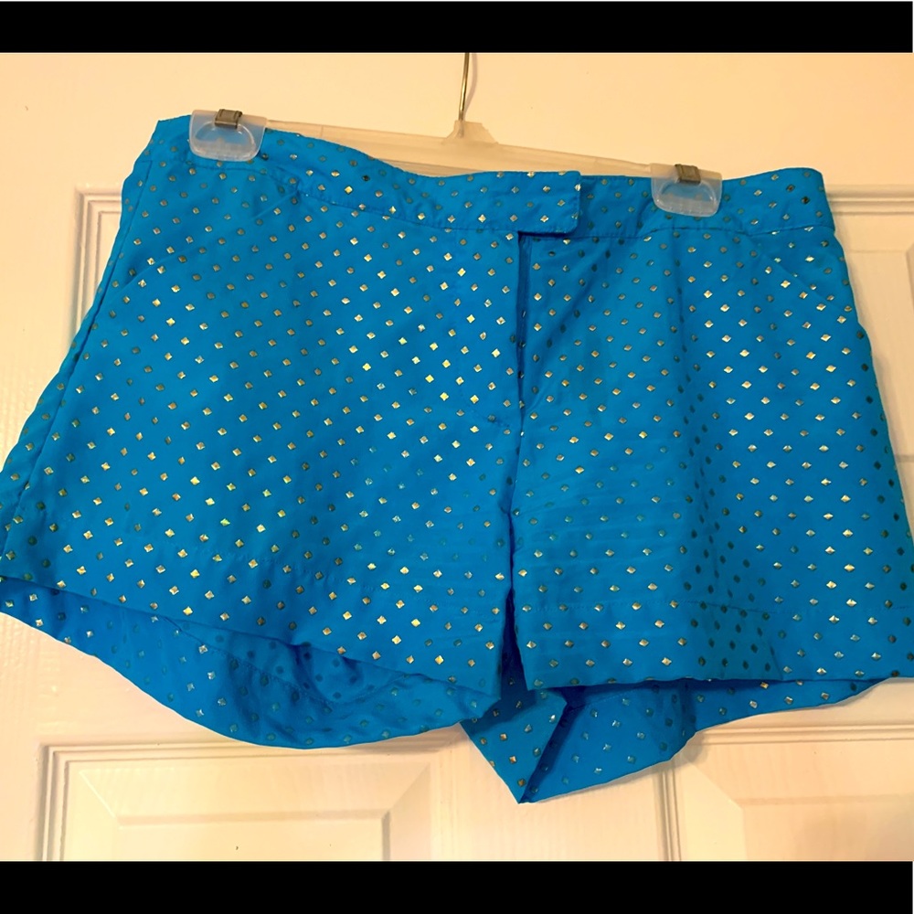 Turquoise with gold shorts. M size.